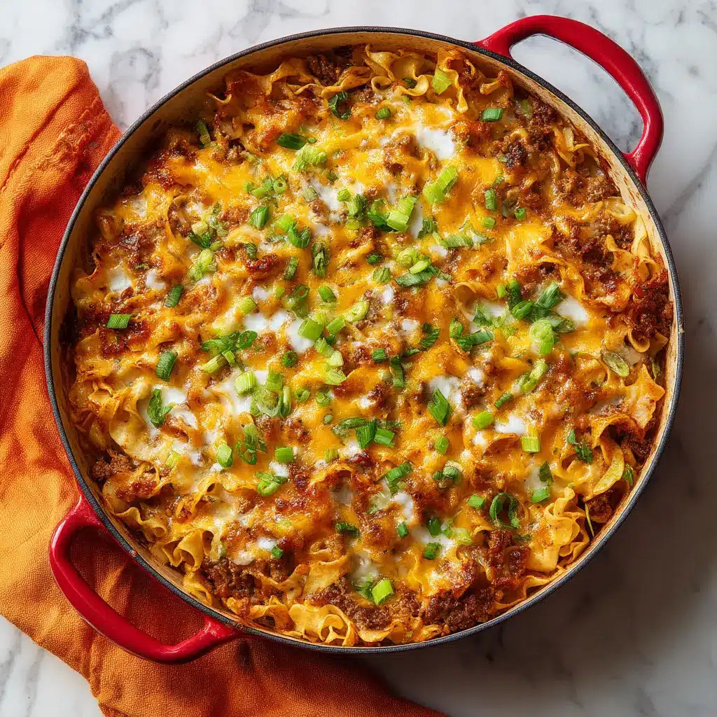 The Ultimate Cheesy Ground Beef Casserole Recipe 1 Cheesy Ground Beef Casserole set on a rustic white marble surface with an orange linen napkin.