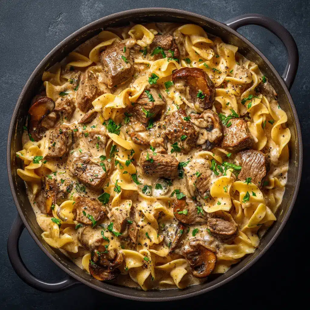 A serving of tender beef stroganoff over egg noodles in a rustic bowl, ready to be eaten.