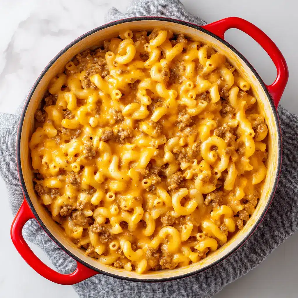 Homemade Hamburger Helper (Better Than the Box!) 1 A spoonful of the final Homemade Hamburger Helper, showing the perfect combination of ground beef, pasta, and melted cheddar cheese sauce.